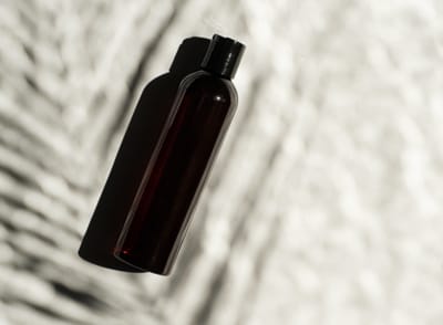 Dark glass bottle of traditional Ayurvedic massage oil used for Home Healing at Agathiyar Vaidhya Salai